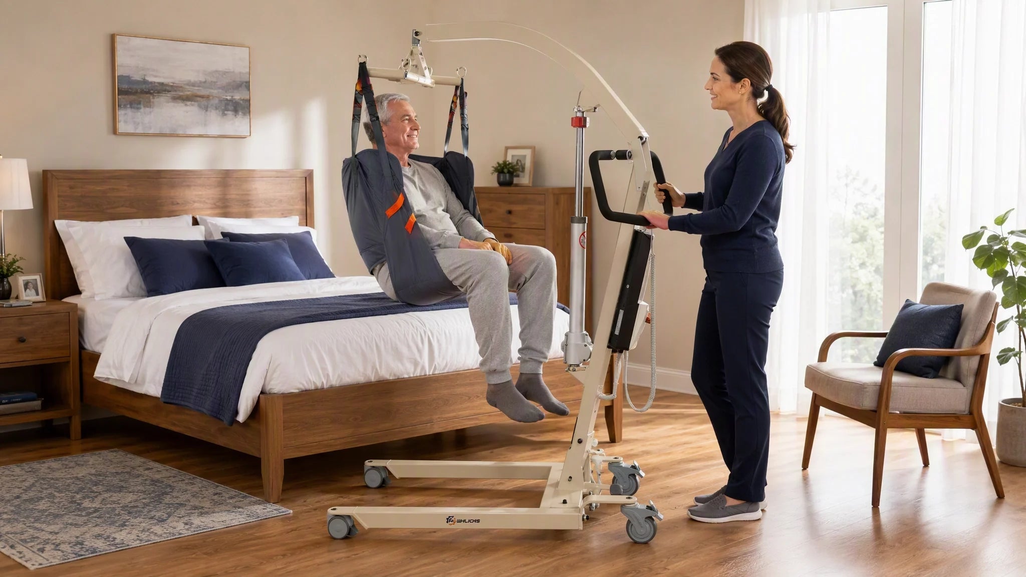 Elderly man using an electric patient lift transfer chair with caregiver assistance at home