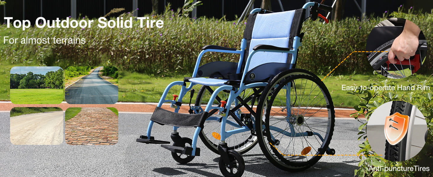 Whlicks Blue wheelchair with solid tire on a road, surrounded by greenery.