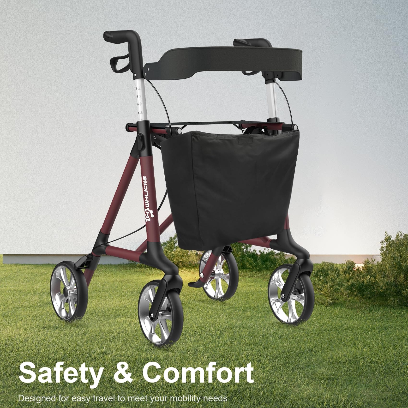 Rollator with a black bag on a grassy background, emphasizing safety and comfort#color_red